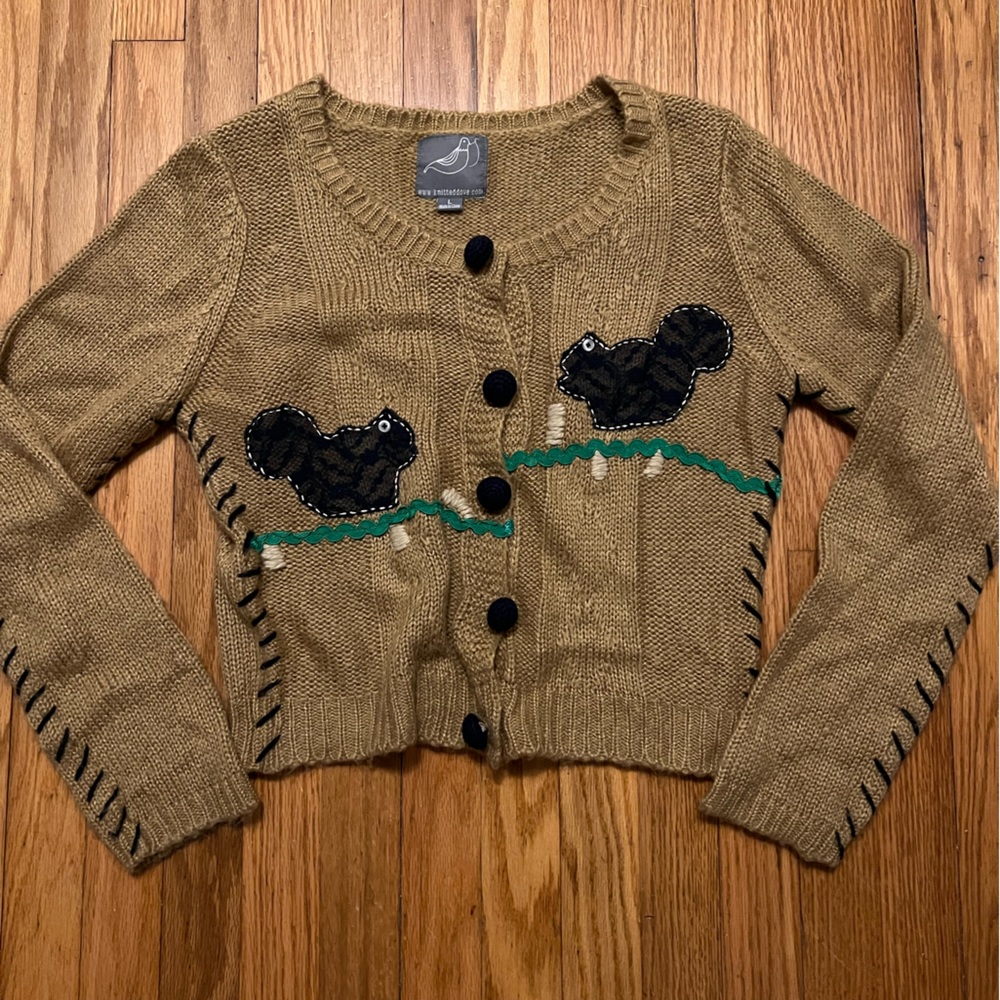Crop cardigan with squirrel and ric-rac applique.